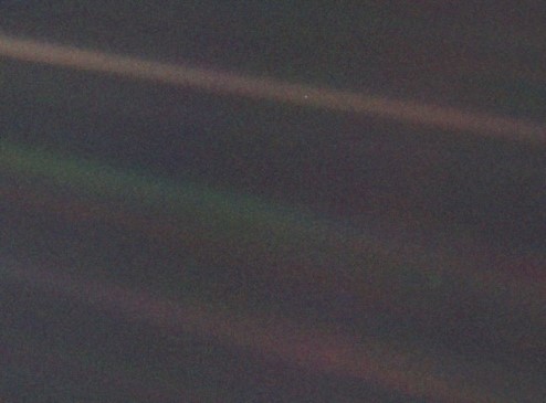 A photograph of Earth, where Earth is only a pixel wide.