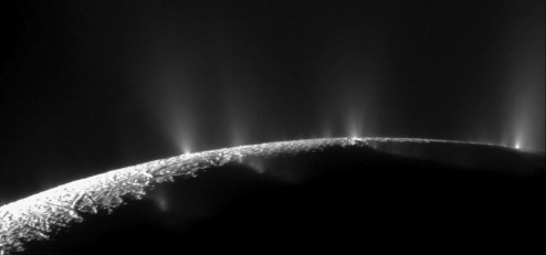 A photograph showing plumes of water on Enceladus.